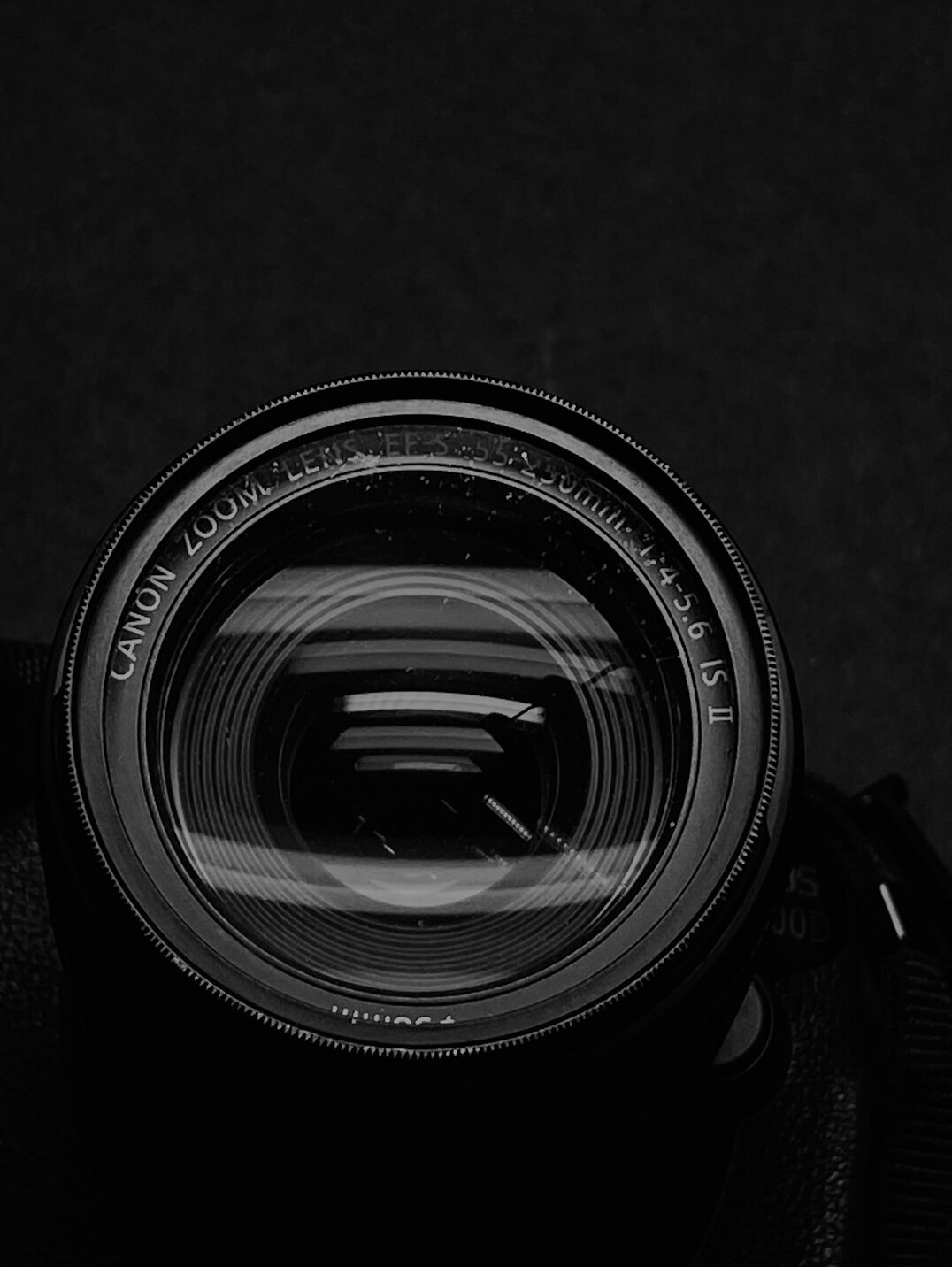 Close-up of a camera lens with reflections