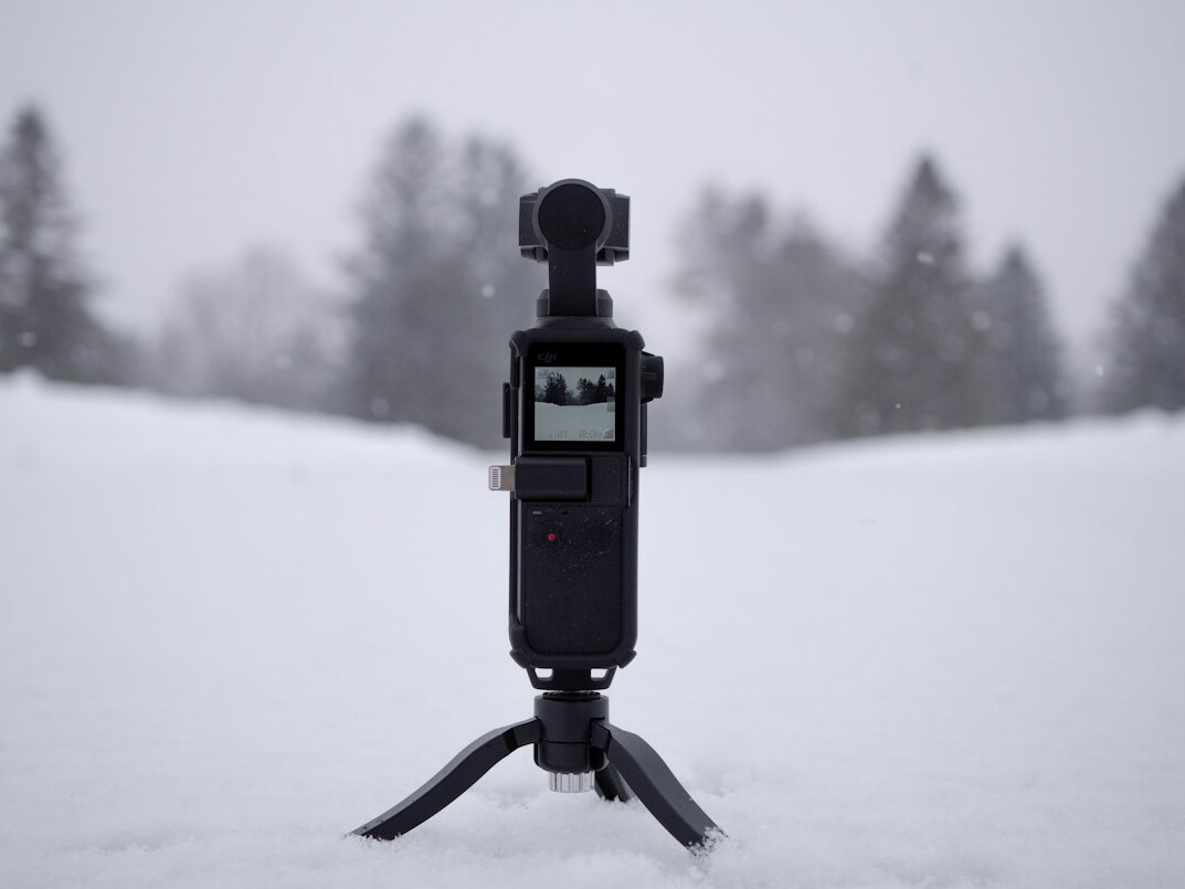 Professional video camera on a tripod in a studio